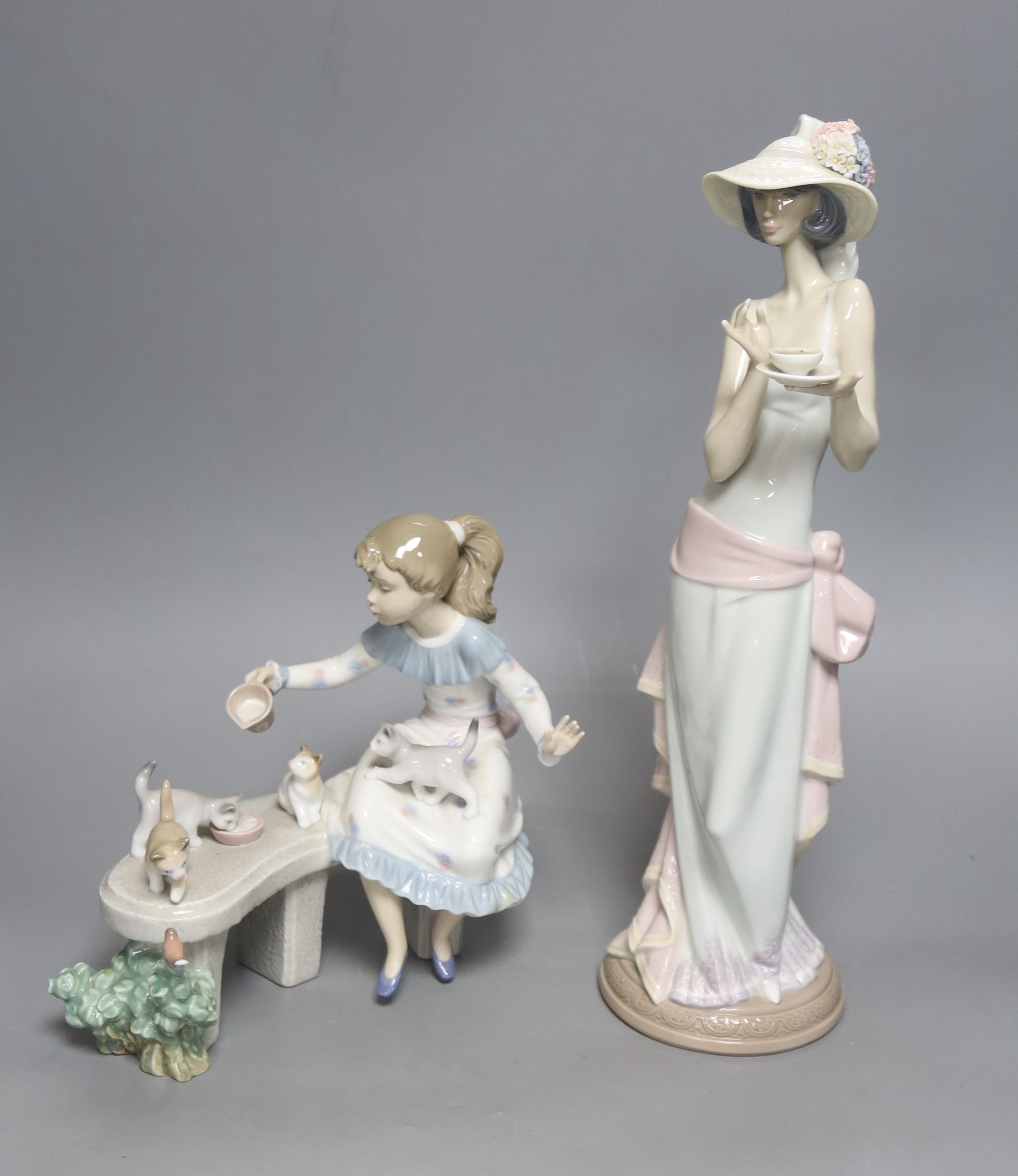 A Lladro figure, 'Tea Time', no. 5470 and another, 'Meal Time,' no. 6109 H 37cm (largest)